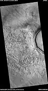 Wide view of fractured surface and pits along wall of crater,  as seen by HiRISE under HiWish program