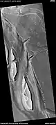 Streamlined shapes, as seen by HiRISE under HiWish program  These were probably shaped by running water.