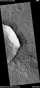 Wide view of crater with layers and mantle in places,  as seen by HiRISE under HiWish program