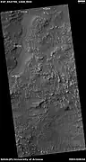 Channel, as seen by HiRISE under HiWish program  Arrows indicate position of channel in this rather dark photo.