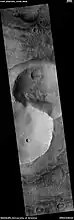 Double crater, as seen by HiRISE under HiWish program  The impactor may have broke apart right before striking the surface.