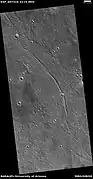 Possible dike, as seen by HiRISE under HiWish program  Here magma probably moved along a fault line underground.  Later erosion removed all but the hardened magma.