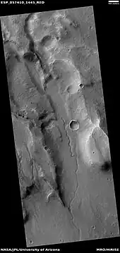 Channel on floor of a valley, as seen by HiRISE under HiWish program  The small channel may have formed at some time after the larger valley; therefore, water may have been here more than once.