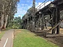 A wooden bridge surrounded by trees