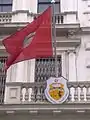 The Tunisian flag and coat of arms above the entrance