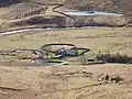 A farmstead standing between the river and a stream