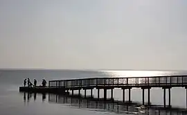 Boardwalk over Currituck Sound with reflecting sunlight