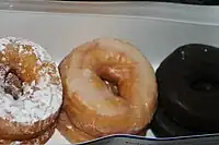 Powdered, glazed and chocolate doughnuts from a variety pack sold at supermarkets