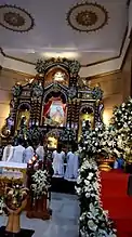 Our Lady of Aránzazu being enthroned on her retablo at the high altar of the church