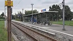 Single-tracked railway line with canopy-covered platform