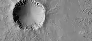 Crater showing layers and small craters in the ejecta that show a thin ejecta pattern  Image taken with HiRISE under HiWish program.