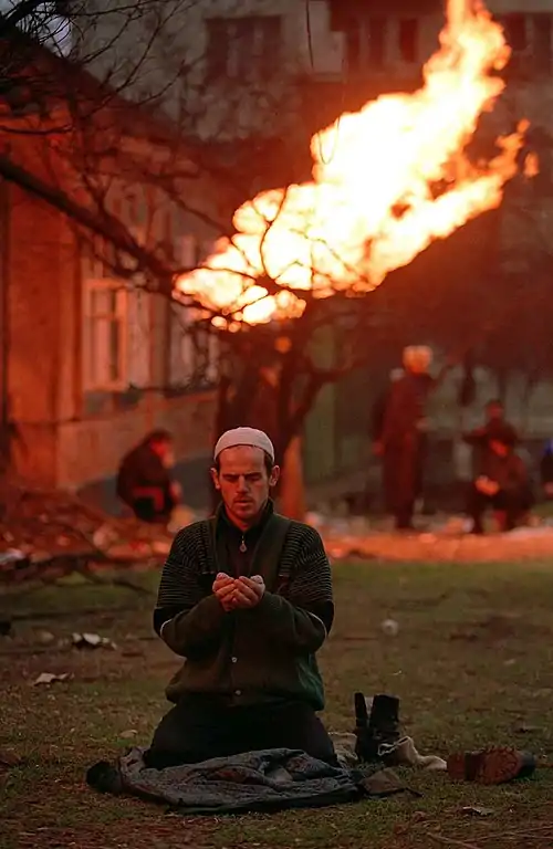 Image 8Chechen separatist fighter praying during the First Chechen WarCredit:Mikhail Evstafiev