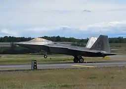 An F-22 Raptor landing at Elmendorf AFB, demonstrating aerodynamic braking.