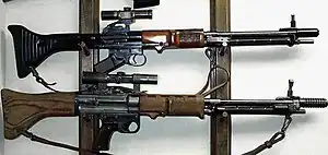 The FG 42 battle rifle/automatic rifle was one of the first inline fire arms incorporating a "straight-line" recoil configuration to reduce muzzle rise.