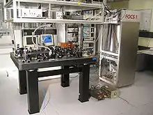 A laboratory table with some optical devices on it.