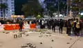 Residents blocking Fai Ming Road with traffic barriers and bricks