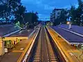 Fairfield railway station as viewed from the pedestrian overpass at dusk