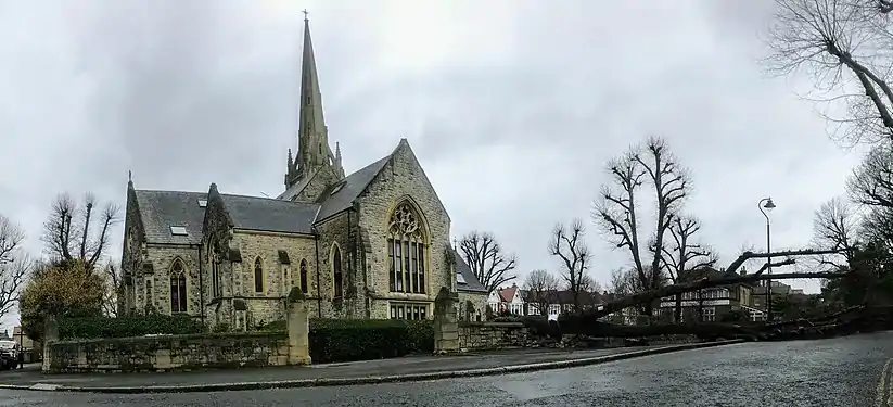 The stone church exposed after Storm Eunice blew down a tree