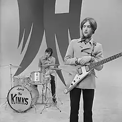 Dave Davies of the Kinks holding one of fewer than 100 Korina Flying Vs manufactured during their initial 1958–1959 run