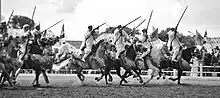 Image 40Taburida, a traditional Arab exhibition of horsemanship performed during festivals (from Culture of Morocco)