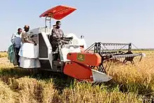 Image 44Farmers using a rice harvester to harvest rice in Igunga District, Tanzania (from Tanzania)