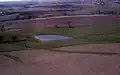 Aerial view of pond on farm land