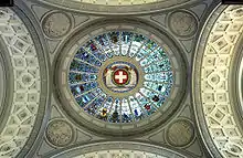 Dome of the Federal Palace. The name Jura can be read at the bottom of the picture, indicating where the coat of arms of the Canton of Jura was placed after the secession from Berne in 1979