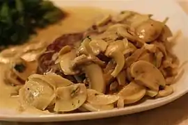 Filet mignon with a chunky, cream-based mushroom sauce