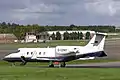 The control tower and a visiting Learjet 60 business jet