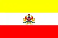 Flag with 3 bars of yellow, white and red with Karnataka's state emblem in the middle of the white bar