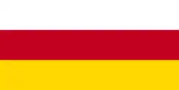 The flag of Ossetia, a simple horizontal triband.