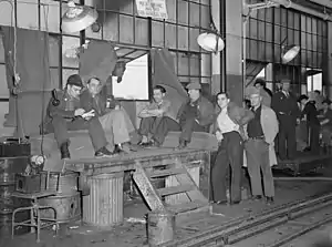 Image 14Union members occupying a General Motors body factory during the Flint Sit-Down Strike of 1937 which spurred the organization of militant CIO unions in auto industry (from History of Michigan)