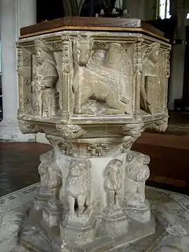 The 15th-century font depicting 'wild men'