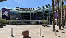 photo showing the semi-circular entrance to the Footprint Center in downtown Phoenix, blue sky in background