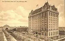 Postcard from 1913, printed in sepia tone depicting the exterior of a 12-storey chateaueasque hotel