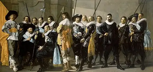 Image 7SchutterijDe Magere Compagnie (completed 1637), which depicts a company of schutterij, a voluntary city guard or citizen militia in the medieval and early modern Netherlands. Frans Hals was commissioned to create this, but he was unable to complete it after three years, and the company hired Pieter Codde to finish it. Group portraits such as this of schutterij were known as schuttersstuk, and were popular among the guards themselves.More featured pictures