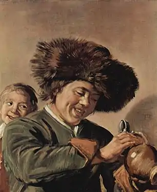 Two laughing boys with mug of beer, with an accomplice on the right