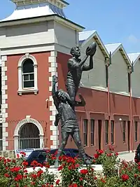 Image 18Statue in Fremantle of an Australian rules footballer taking a spectacular mark (from Culture of Australia)