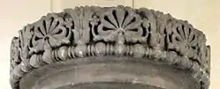 Frieze of the lost capital of the Allahabad pillar, with two lotuses framing a "flame palmette" surrounded by small rosette flowers, 3rd BCE