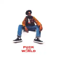 A photo of Faiyaz sat on a white seat which blends in with the all-white background. The album name appears at the bottom of the image in red with a globe in place of the O.