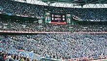 An electronic scoreboard at a football ground.