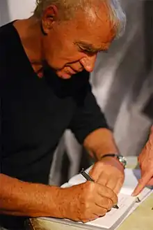 Janusz Głowacki signing his books