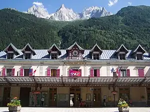 Three-story building with gabled roof