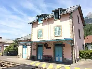 Three-story building with gabled roof