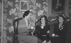 Women in the Garneau lobby sitting in opulent furniture