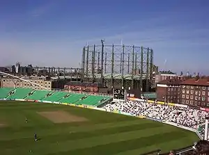 One of the Oval Mansions blocks under renovation in 2005, next to gasholder and cricket ground