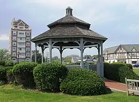 The gazebo on The Plaza.Note the Tudor Revival architecture on the buildings behind it to the right, and the Tower at Montauk to the left.