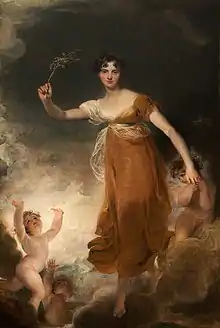 young woman holding a sprig of leaves