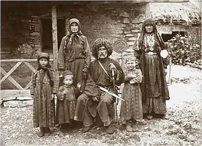 Georgian poet and writer Vazha-Pshavela (centre) wearing a Georgian papakha with his family