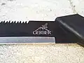 Gerber logo on machete/saw combo